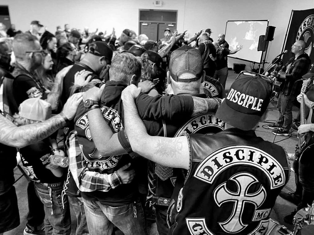 Disciple Christian Motorcycle Club members gathered in prayer